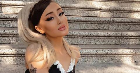 Paige Niemann sitting on steps looking like Ariana Grande.