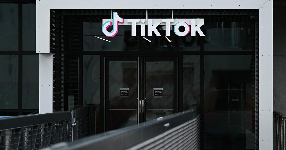 The TikTok logo outside a pair of double doors. 