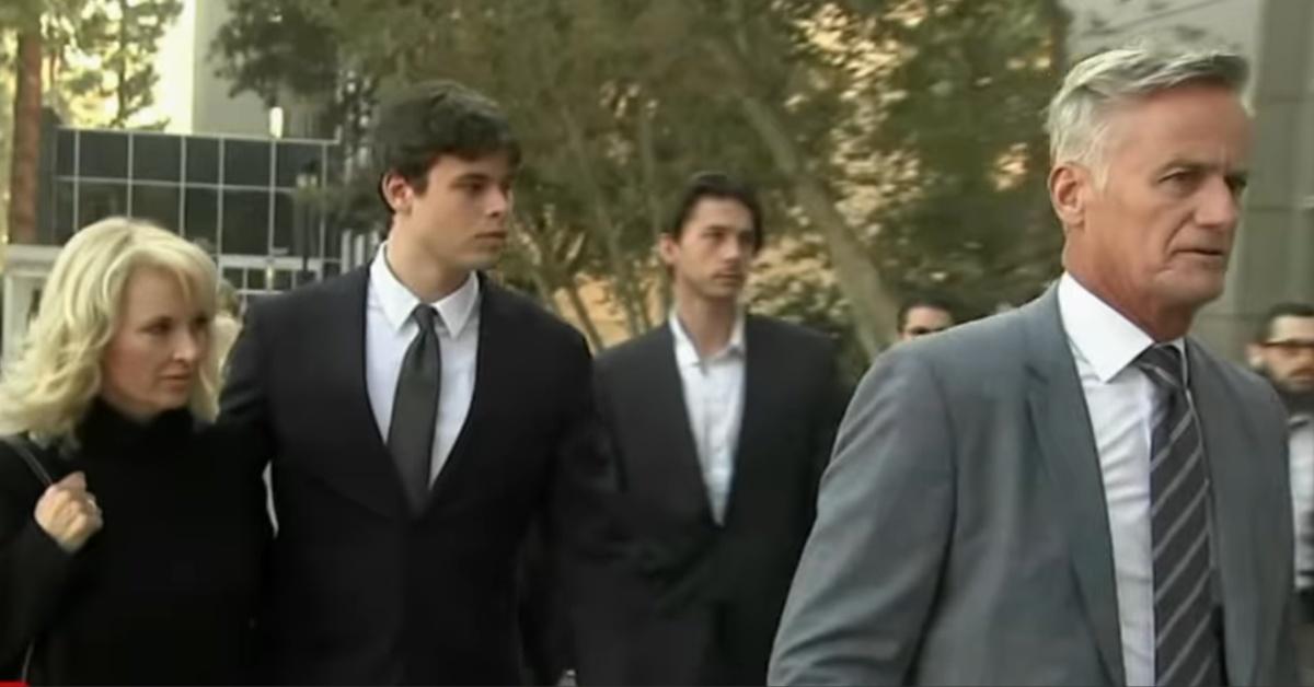 Fraser Bohm enters court with his parents. Brooke and Chris Bohm.