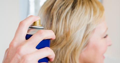Woman getting hairspray