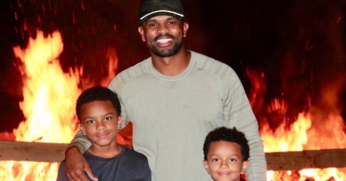 (l-r): Corey Dixon, Juan Dixon, and Corey Carter posing in a photo together. 