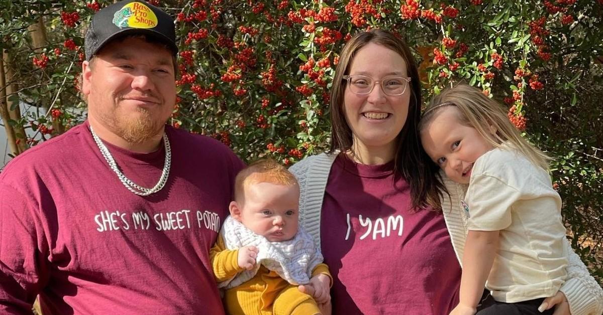 (L-R) Joshua Efird in a red shirt and Lauryn Efird in a redi shirt, both hold two of their kids in an Instagram family photo 