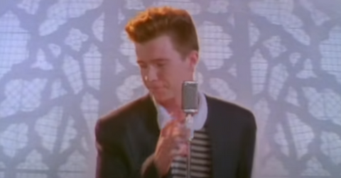 Rick Astley loving life in the 'Never Gonna Give You Up' video.