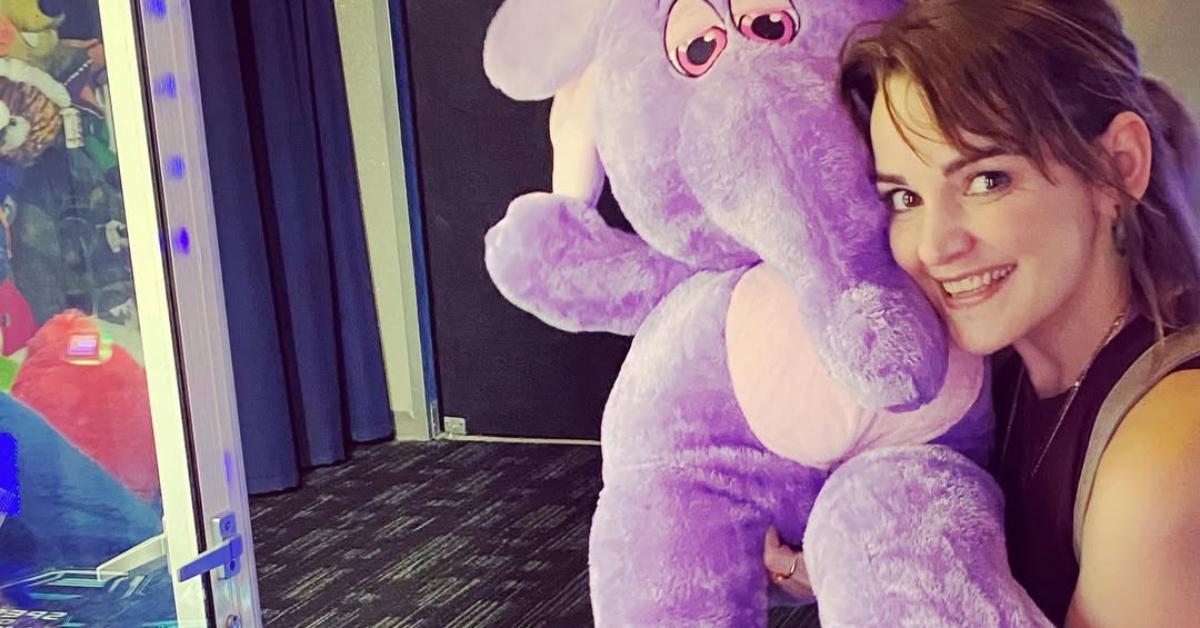 Laura-Leigh poses with a purple elephant