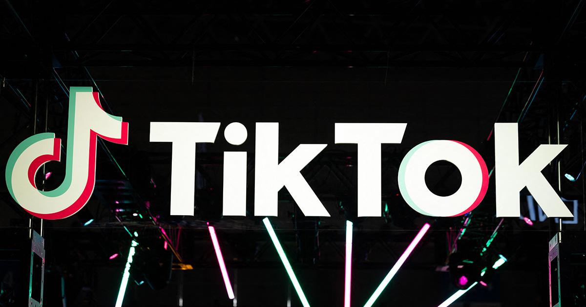 The TikTok logo on a stage. 