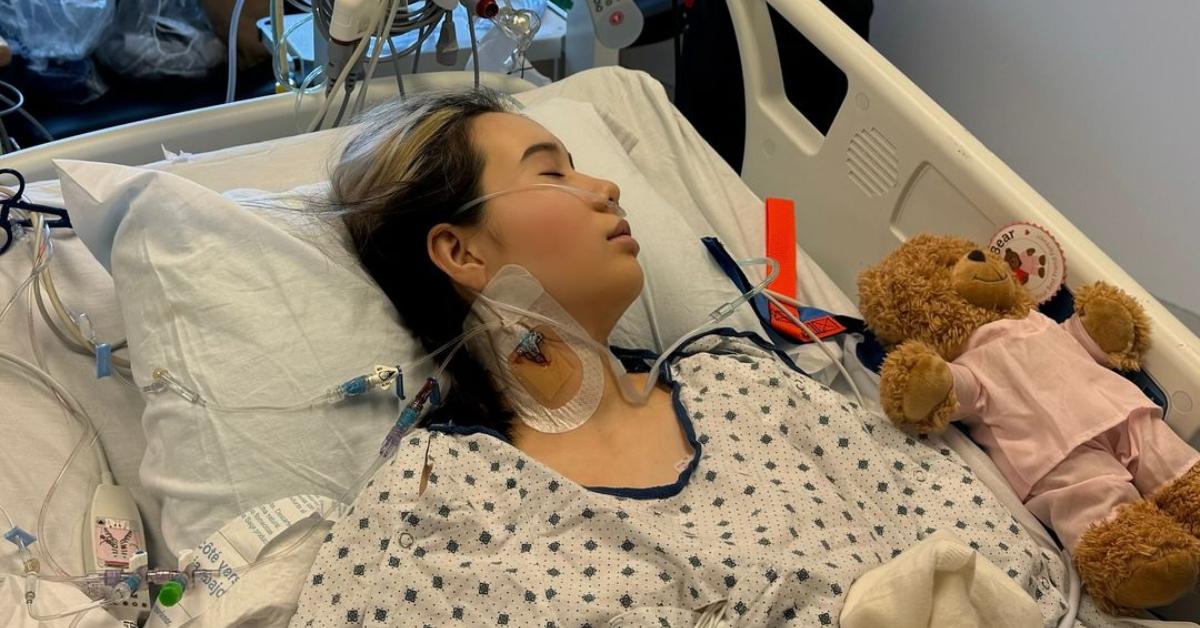 Lil Tay sleeps in her hospital bed following open-heart surgery.