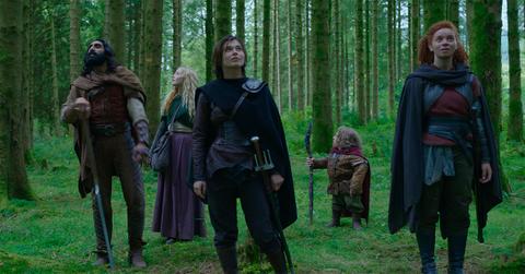 The cast of 'Willow' standing in the woods.