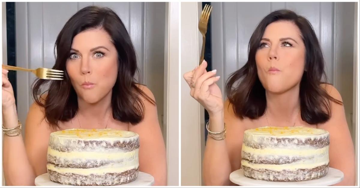 Tiffani Amber Thiessen takes a bite out of a carrot cake while in the nude. 