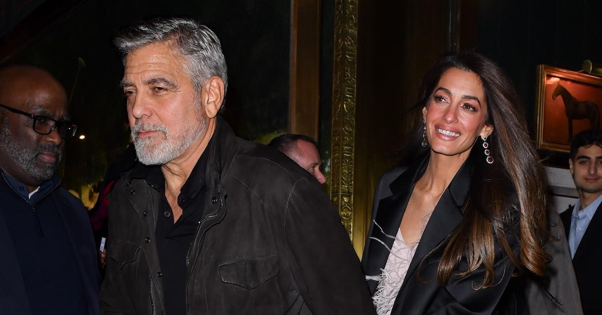 George and Amal Clooney arriving at the Polo Bar on Dec. 13, 2023 in New York City