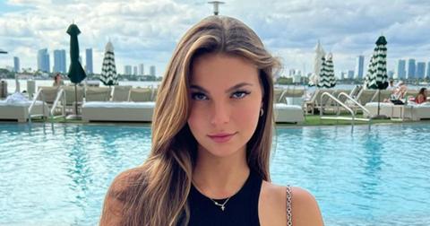 Grace Boor sitting by a pool