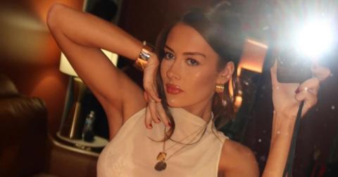 Brooke Schofield posing in front of a mirror taking a selfie.