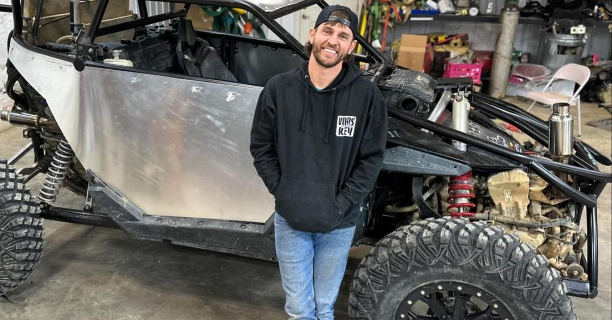 Bryce Sparks stands with his ATV