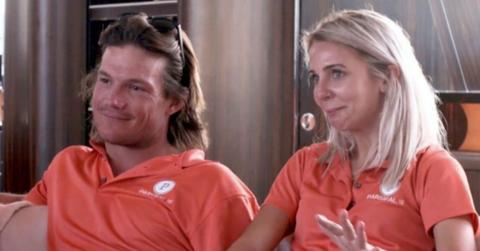 Gary and Syndey sitting together while working on a yacht.