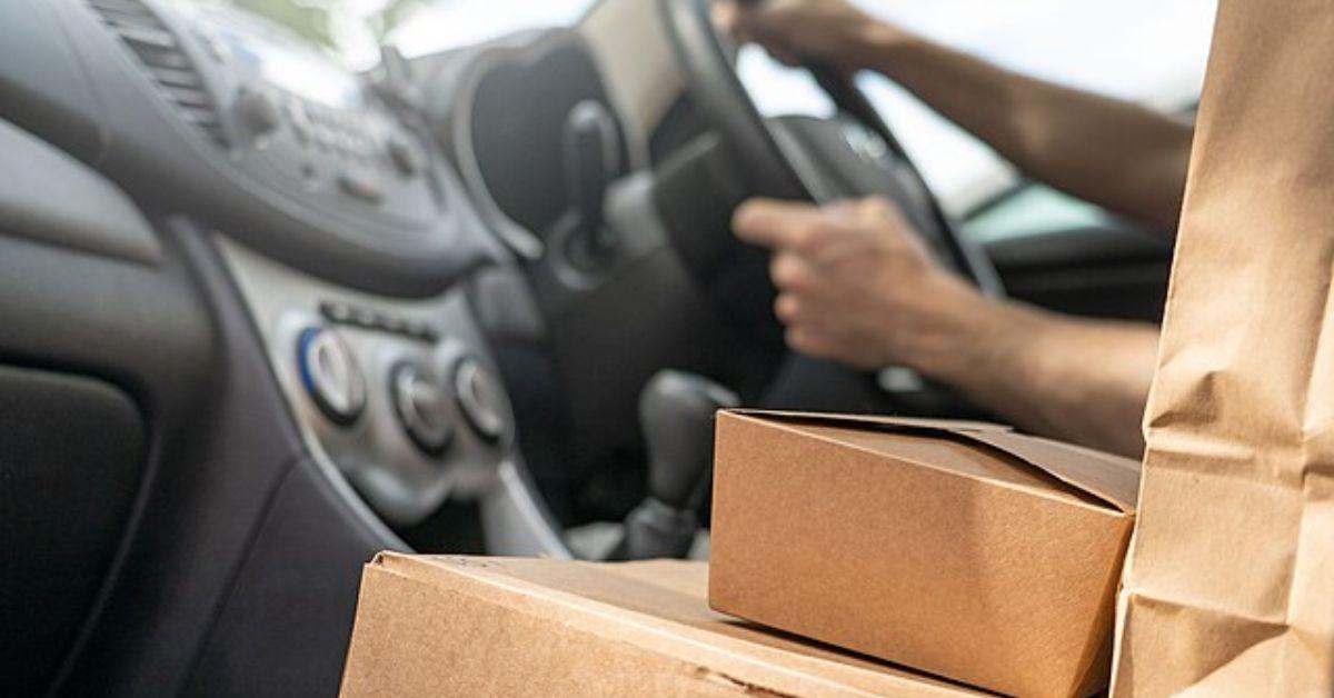 Food in a passenger seat being delivered. 
