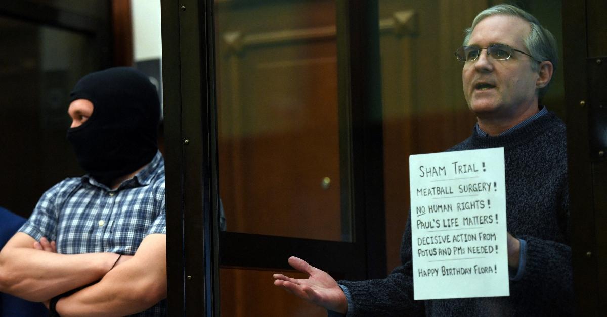 Paul Whelan stands inside a defendants' cage as he waits to hear his verdict