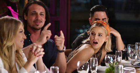 Ariana Madix leans over a bar with Stassi on Vanderpump Rules