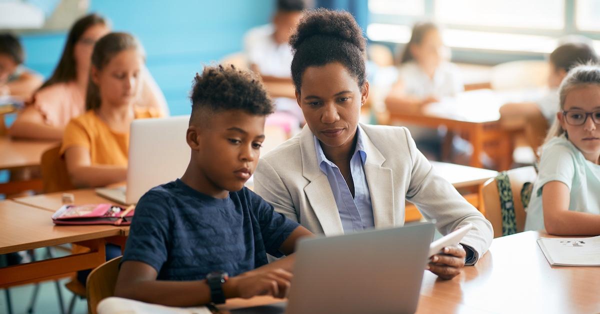 A teacher helping a student