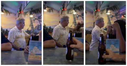 A drunk man fights his reflection in mirror