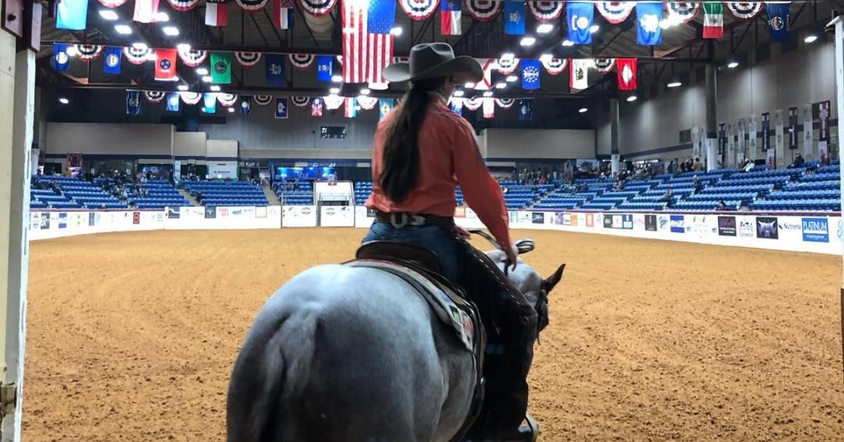 Veronica Swales on her horse entering an arena.