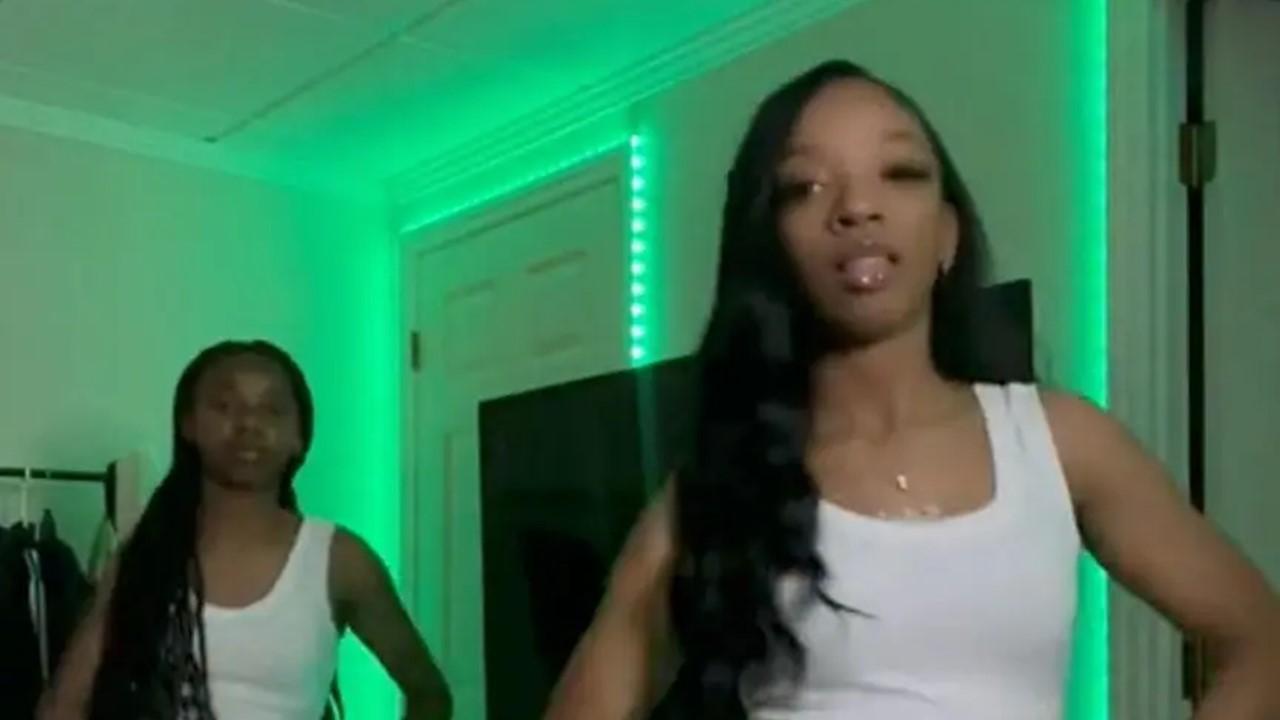 Two women dancing as part of the DMV dance challenge on TikTok