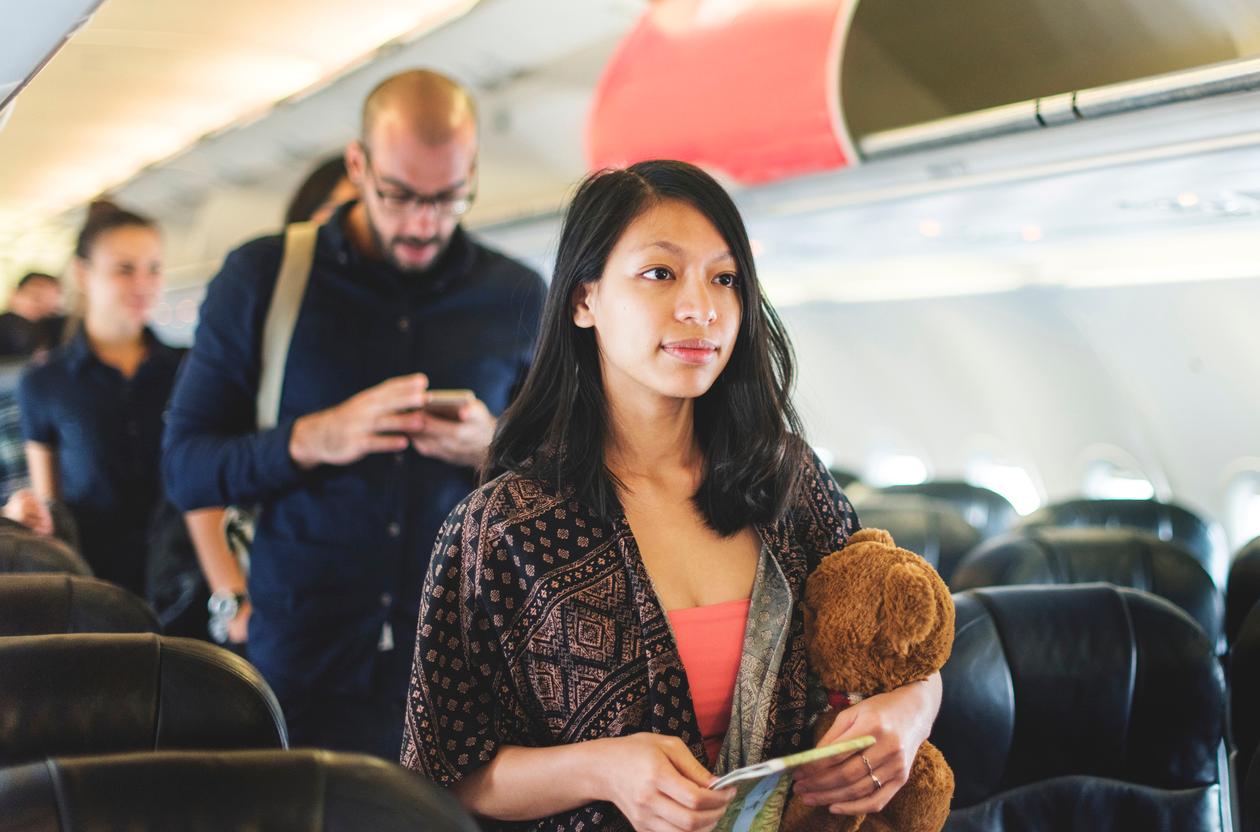 women stop creepy man on airplane