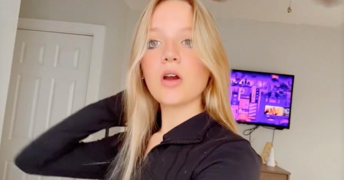 Aubreigh Wyatt in black shirt lip-synching in a TikTok video