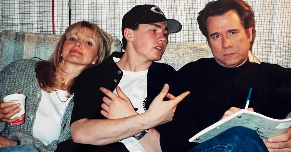 John Larroquette with his son and wife on a couch