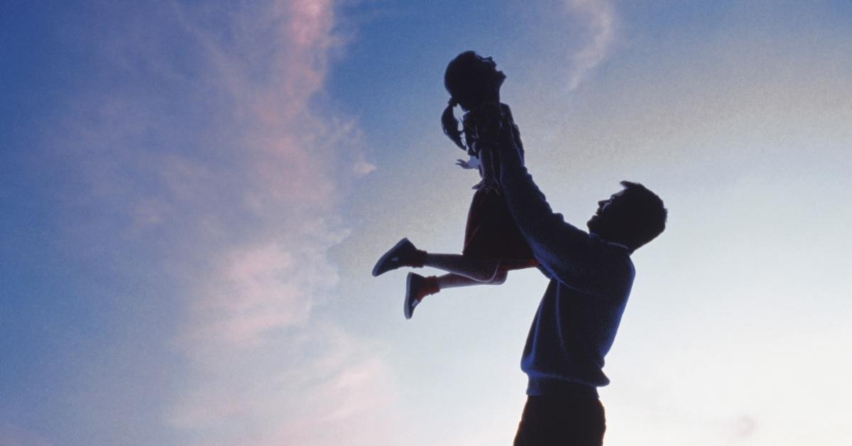 dad lifting daughter in air