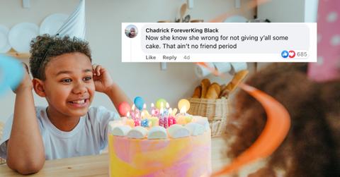 Little boy wears a birthday hat and looks excited about eating birthday cake.