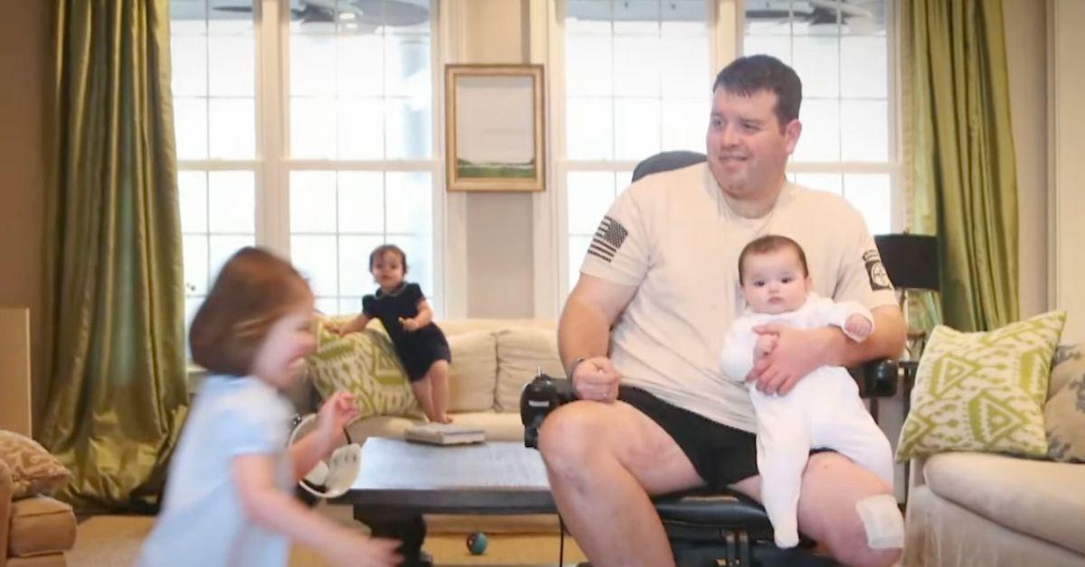 Michael Verardo with his three daughters in their living room.