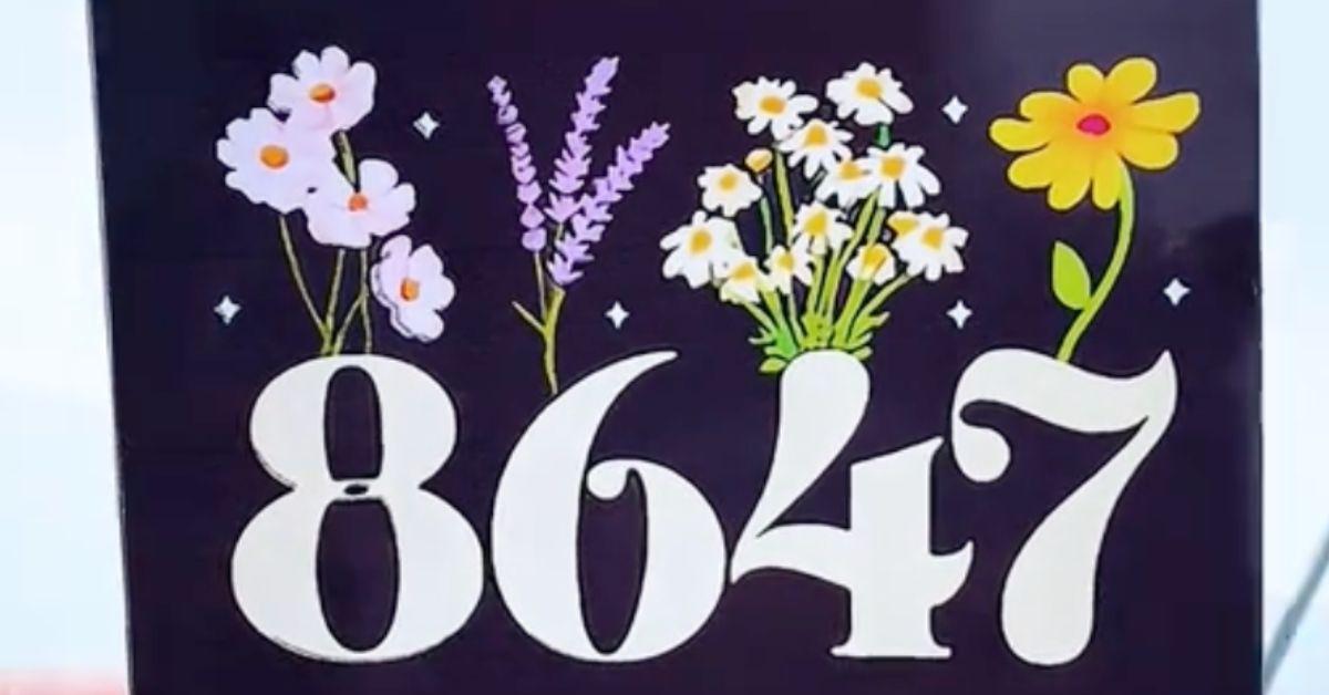 An 8647 sticker with flowers sprouting out of it. 