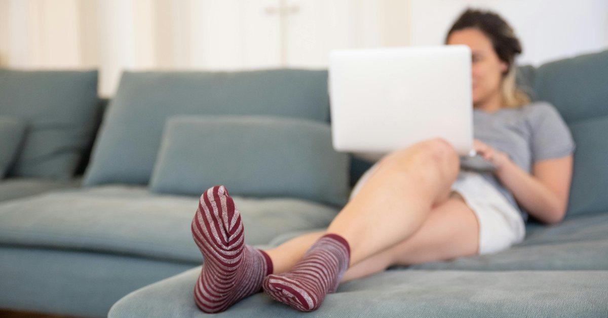 woman on laptop on couch