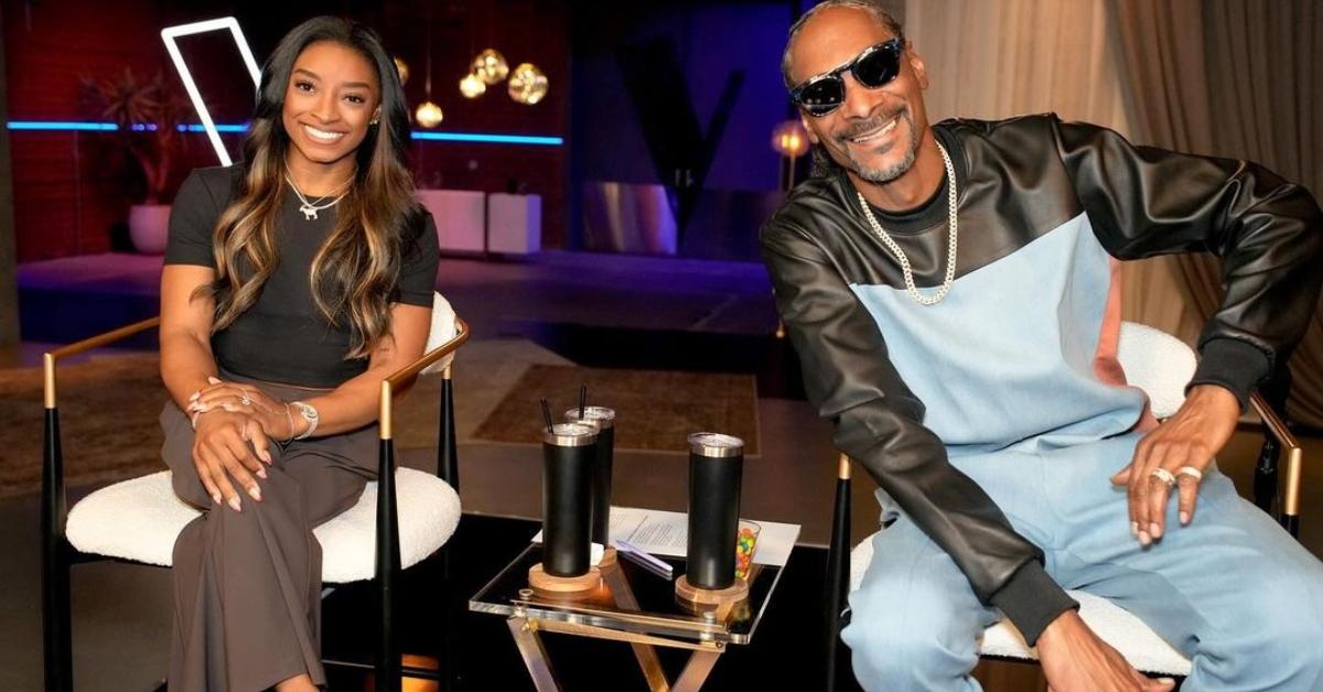 Simone Biles and Snoop Dogg sit in chairs on The Voice