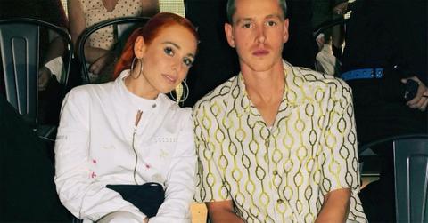 Harris Dickinson and Rose Gray sitting next to each other.