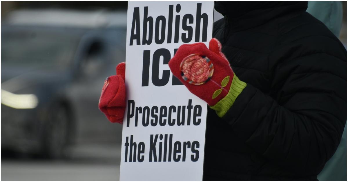 Protester holding a sign at an ICE protest