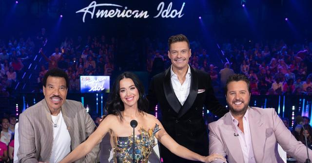 Lionel Richie, Katy Perry, Ryan Seacrest, and Luke Bryan sitting at the judges table on Season 22 of ‘American Idol’.