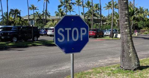 A blue stop sign in Hawaii.