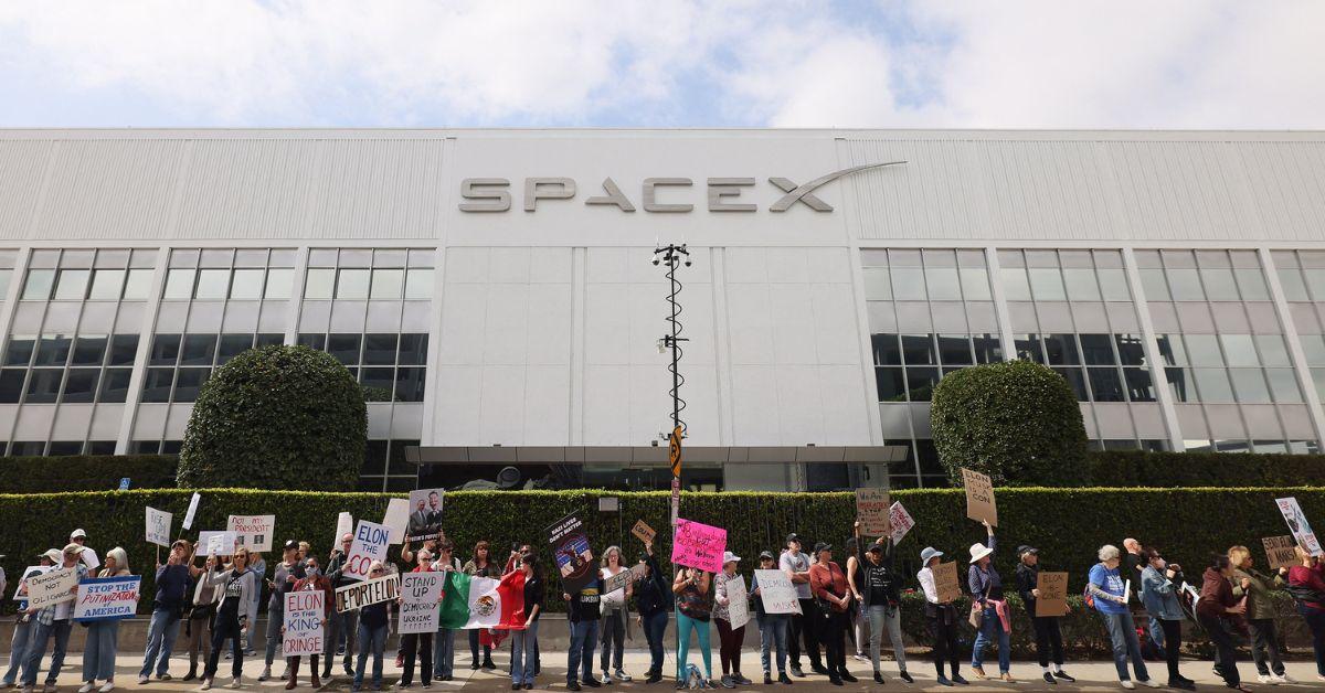 Protesters outside of a SpaceX building. 