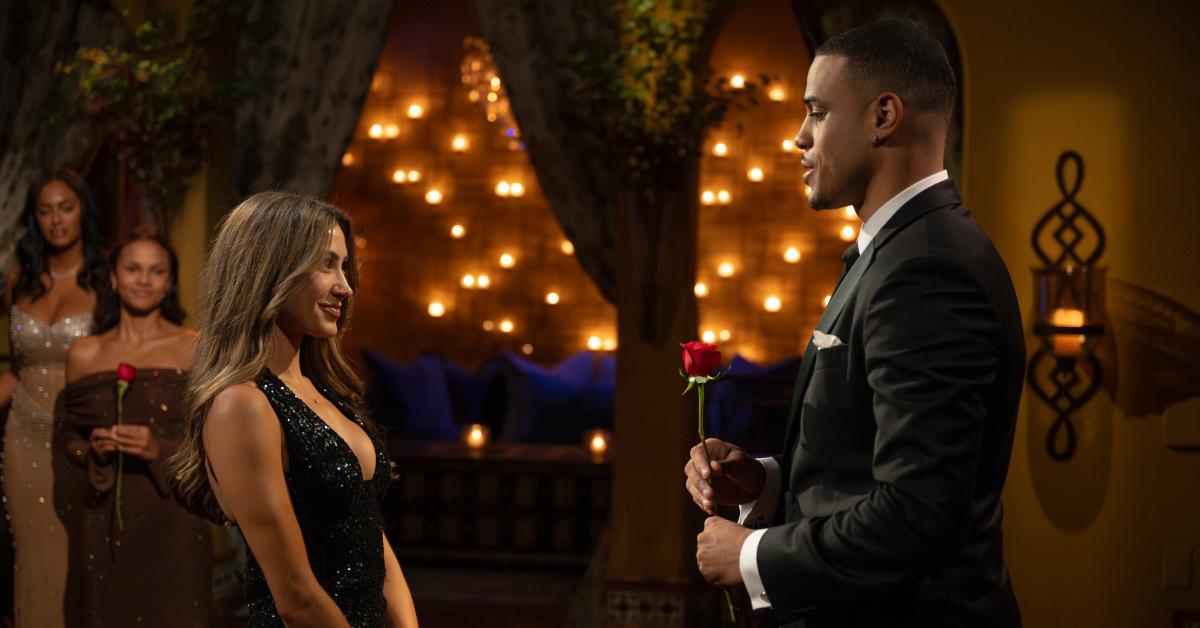 Grant Ellis gives Juliana Pasquarosa a rose during 'The Bachelor.'