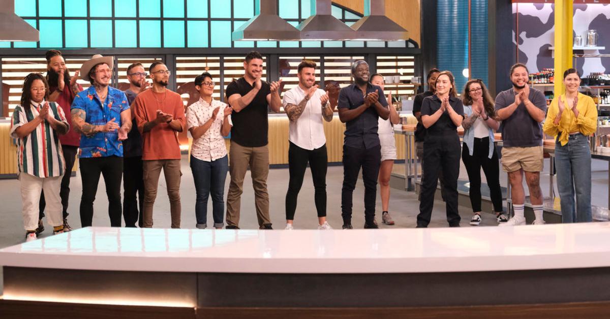 The cast of 'Top Chef: Wisconsin' stands together and applauds before the start of the competition.