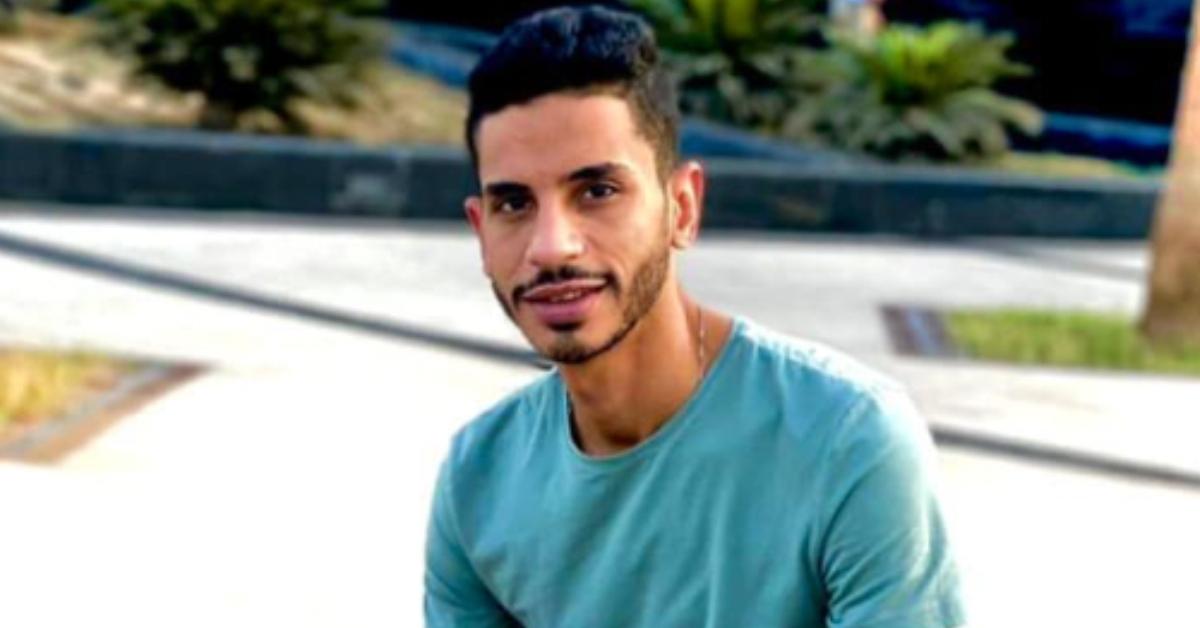 Mahmoud El Sherbiny, clad in a blue t-shirt, smiles for the camera.