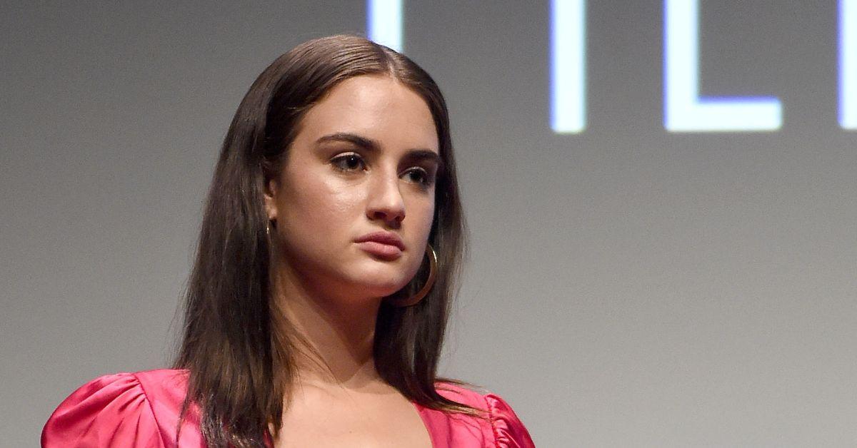 Grace Van Patten looking away from the camera at an event.