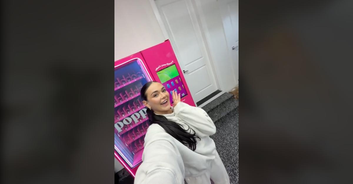 Influencer Kaelie Mae gets a Poppi vending machine delivered to her home.