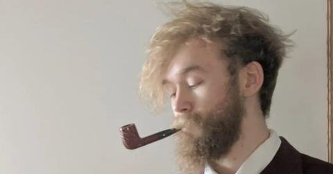 Jack Stauber smoking a pipe