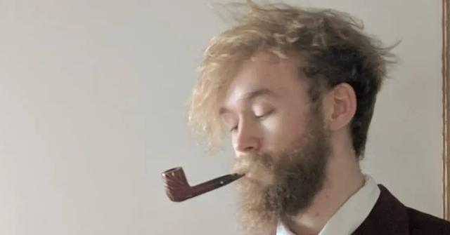 Jack Stauber smoking a pipe