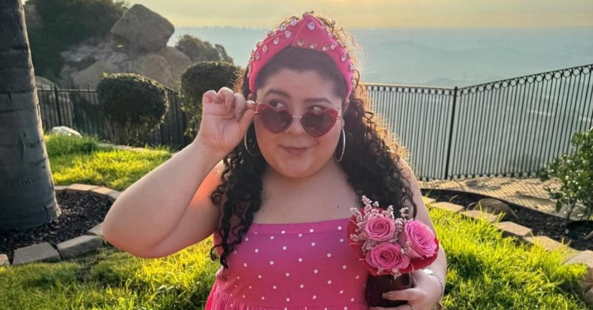 Raini Rodriguez wearing a pink polka dot dress.