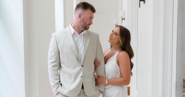 Hailie Jade and her husband, Evan McClintock gazing into each others eyes.