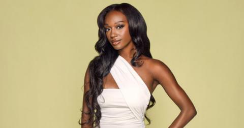 Bria Fleming wears a white cut-out one strap gown for her official 'Summer House: MV' Season 2 portrait.