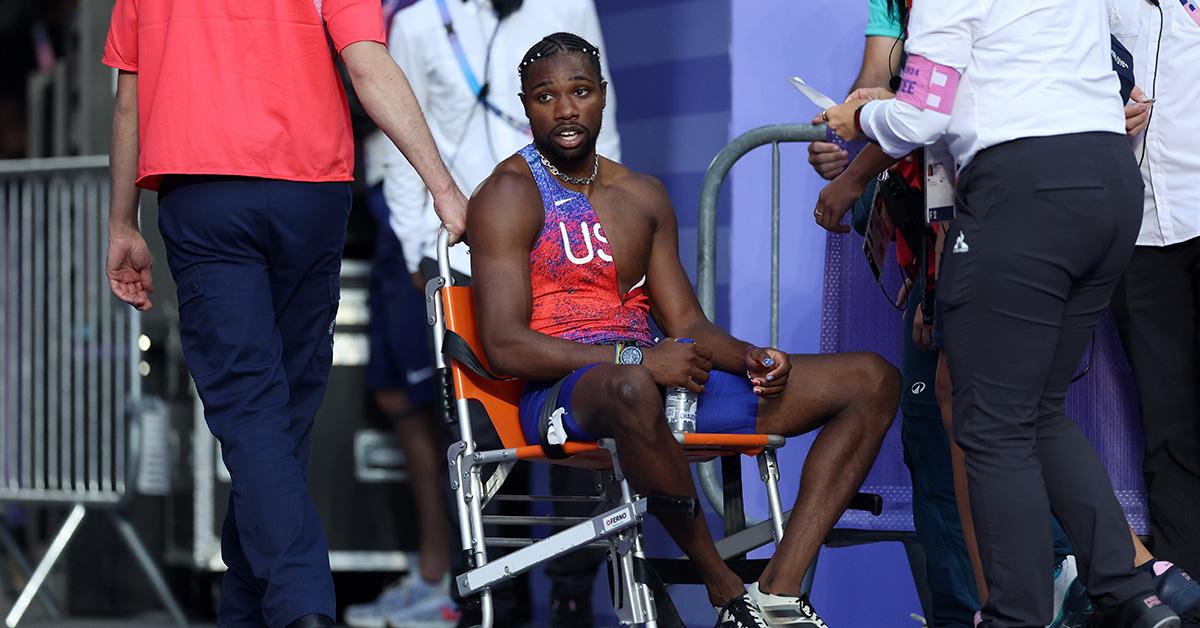 Noah Lyles in a wheelchair after the 200m final. 