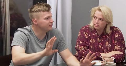 Garrison Brown talking with his mother at a table.